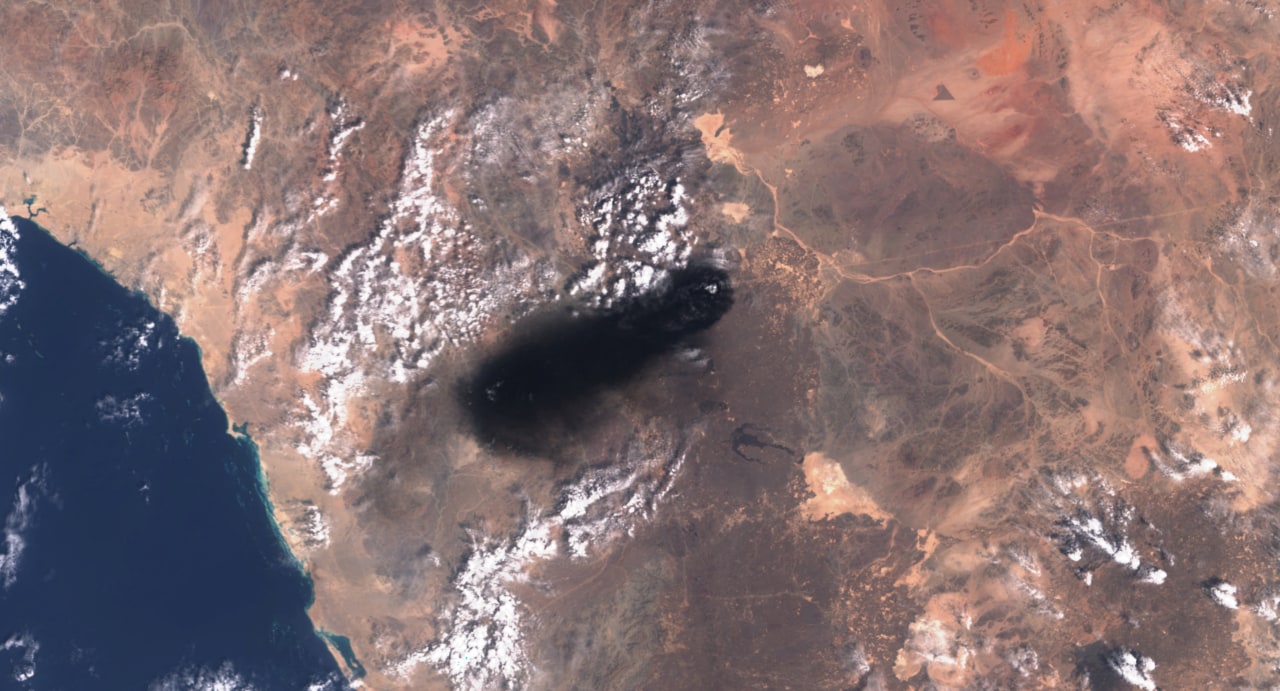 Satellite image showing black smoke plume rising from the East-West Crude Oil Pipeline in Saudi Arabia