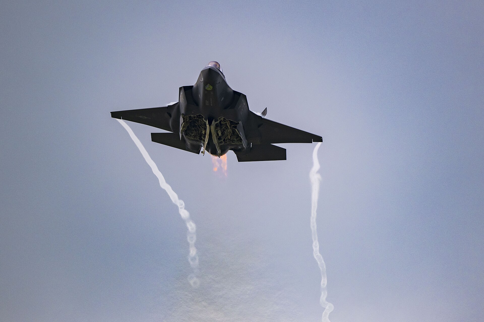 A US Air Force F-35A Lightning II climbs in afterburner during an airshow pass — the fifth-generation stealth fighter at the centre of the $24.3 billion congressional notification to Saudi Arabia