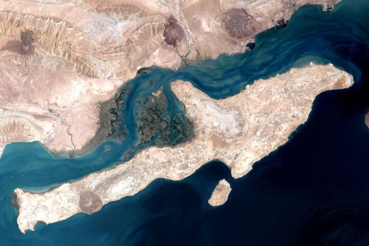 NASA satellite image of Qeshm Island in the Strait of Hormuz, showing the narrow waterway between Iran and the Omani exclave of Musandam