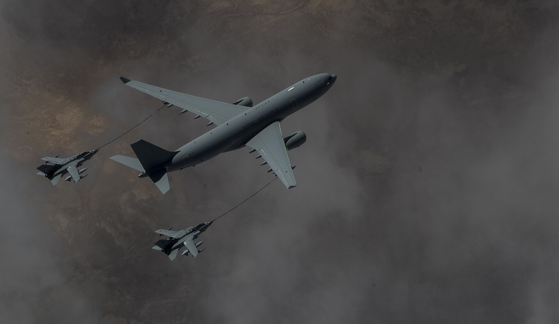 RAF Voyager KC3 tanker refuelling two RAF Tornado GR4 jets through hose-and-drogue over Iraq during Operation Shader