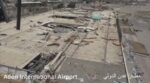 Aden International Airport terminal building gutted by war damage in July 2017, showing collapsed roof and debris across the entire structure
