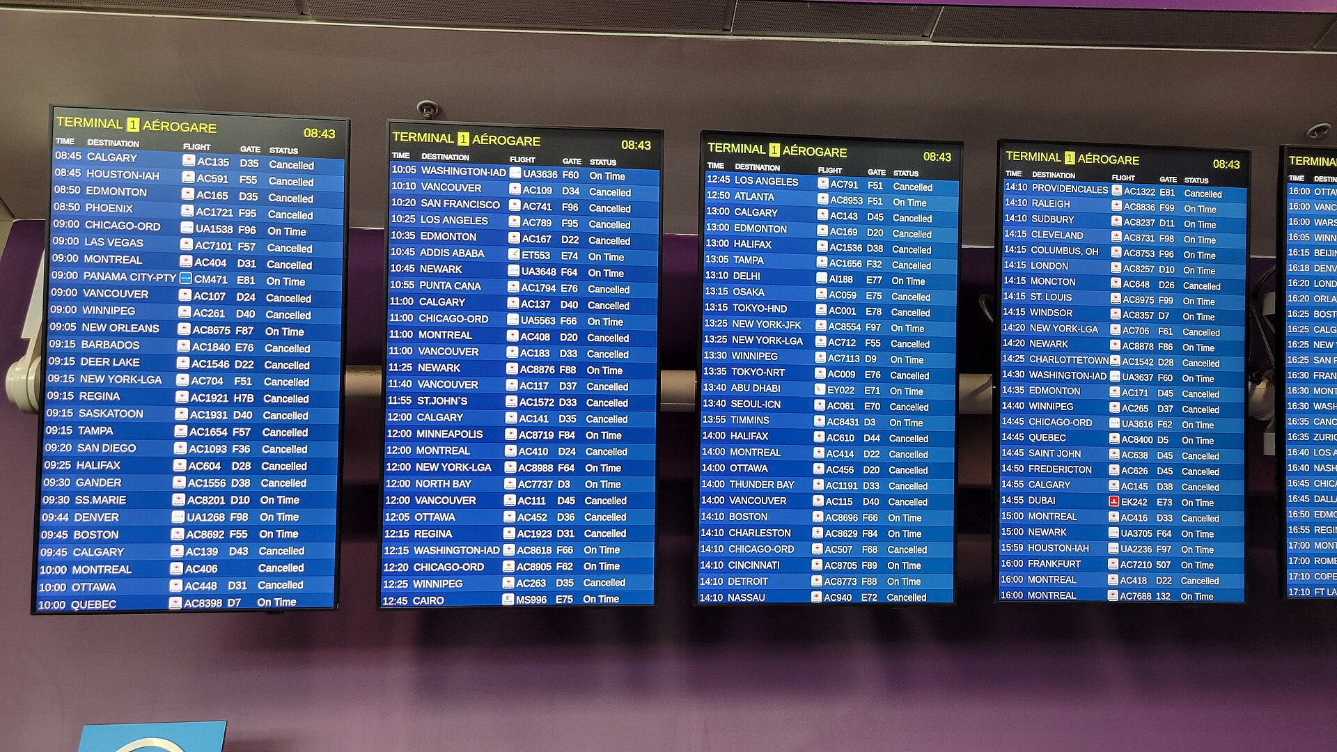 Airport departure boards displaying mass flight cancellations — the operational impact of the Houthi campaign that grounded more than 3,100 flights at King Khalid International Airport between 8 and 14 October 2026
