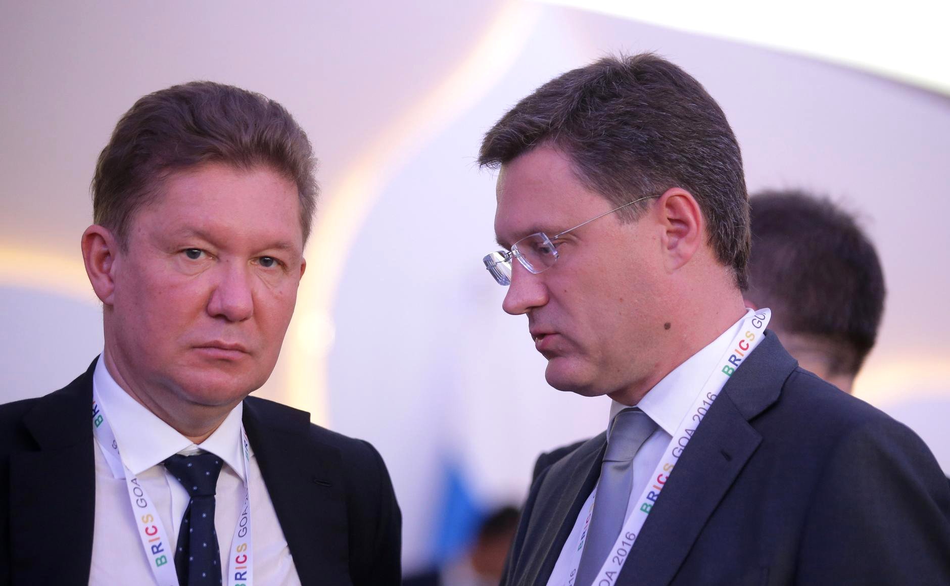 Russian Energy Minister Alexander Novak and Gazprom CEO Alexei Miller in discussion at BRICS summit, Goa, India, October 2016