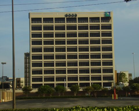 Aramco corporate headquarters office tower displaying the Saudi Aramco star logo, Houston