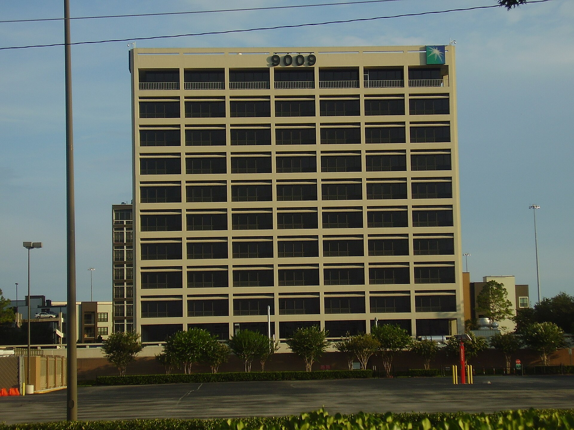 Aramco corporate headquarters office tower displaying the Saudi Aramco star logo, Houston