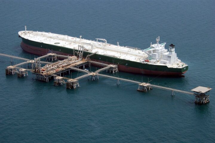 The supertanker Abqaiq loads crude oil at an offshore terminal in the Gulf — the same export chain whose Red Sea corridor now carries a three-million-dollar war-risk surcharge per voyage