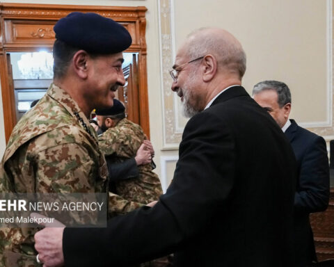 Field Marshal Asim Munir in Pakistan Army camouflage uniform greeting Iran parliament speaker Mohammad Baqir Qalibaf in Tehran, 2026