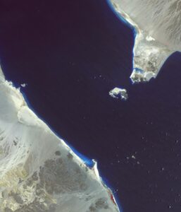 NASA ASTER satellite image of the Bab el-Mandeb strait showing Perim Island at the chokepoint between Yemen and Djibouti