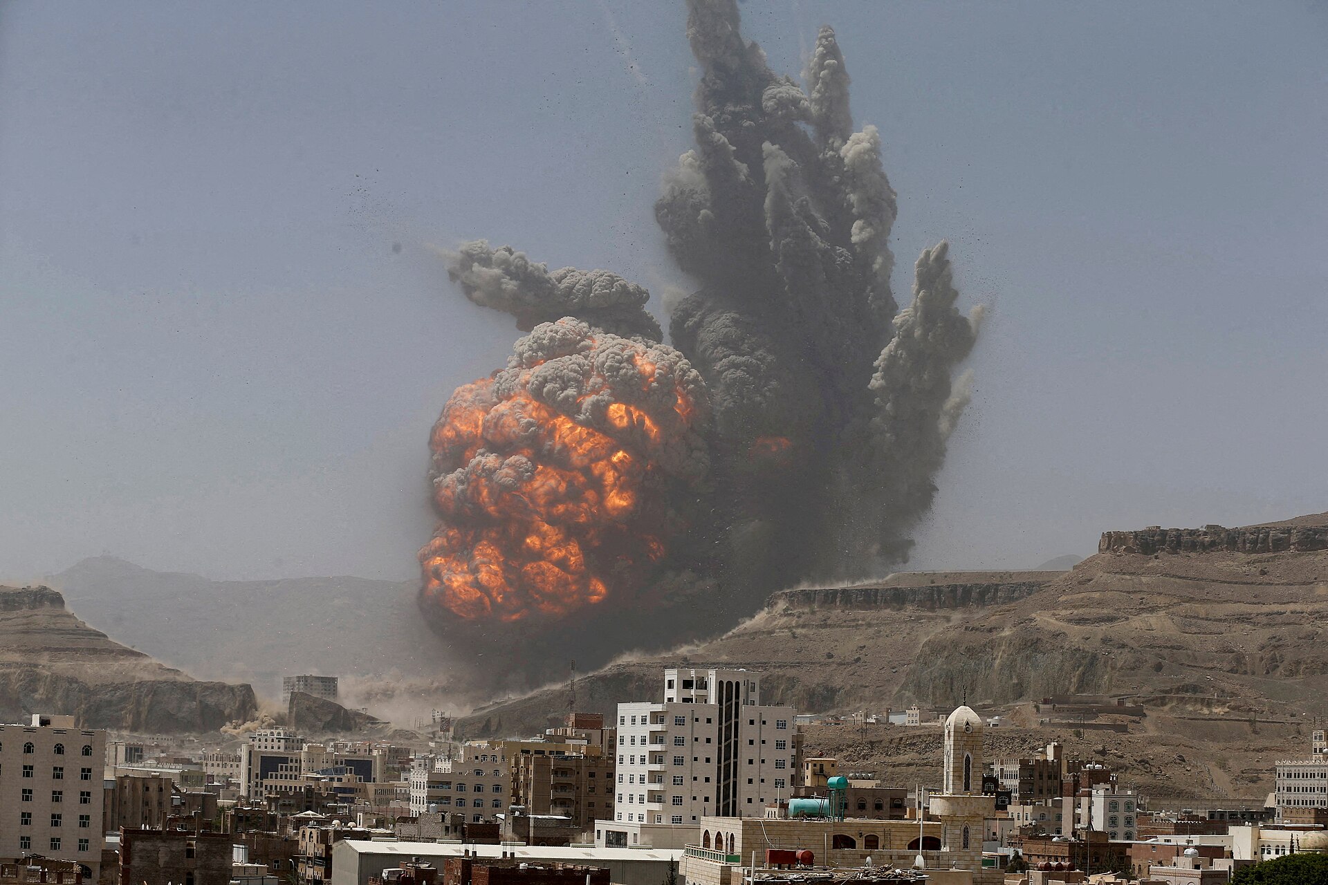 Smoke and fireball rise over Sanaa as a Saudi-led coalition airstrike hits an army weapons depot on Mount Attan, April 20, 2015