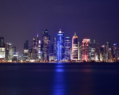 Doha West Bay skyline at night, Qatar — home to the diplomatic mediation track between the US and Iran