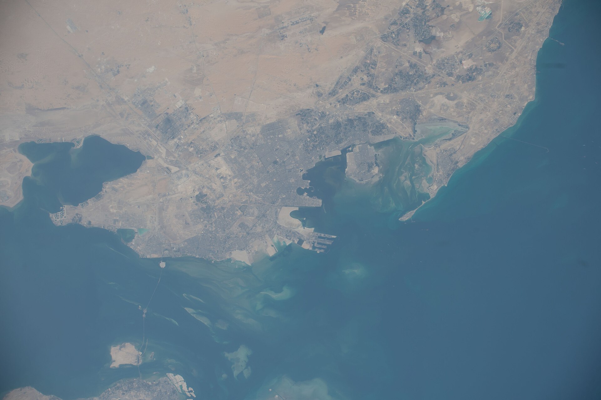 Aerial view of the Eastern Province coastline and Arabian Gulf from the International Space Station, showing Dammam and the industrial corridor — NASA ISS-53 photo