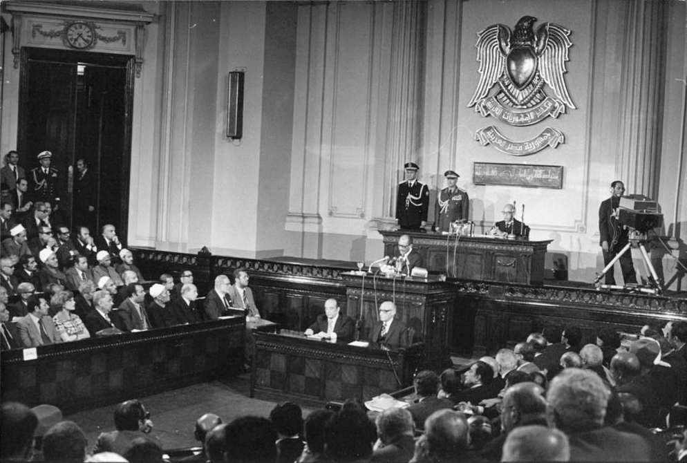 Egyptian People Assembly chamber in full session Cairo 1977 with coat of arms on wall
