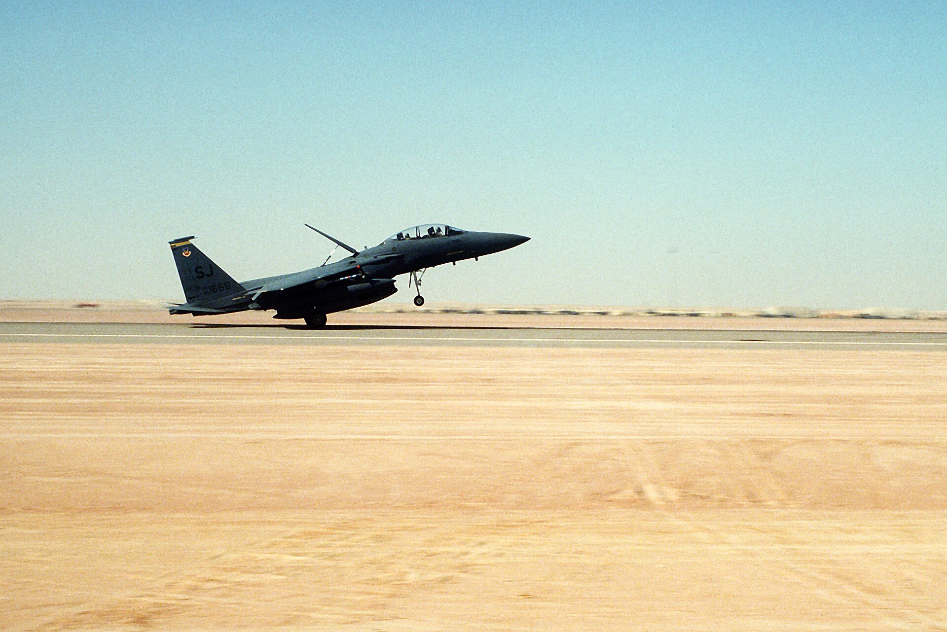 F-15E Strike Eagle landing at desert air base in Saudi Arabia during Operation Desert Shield 1990
