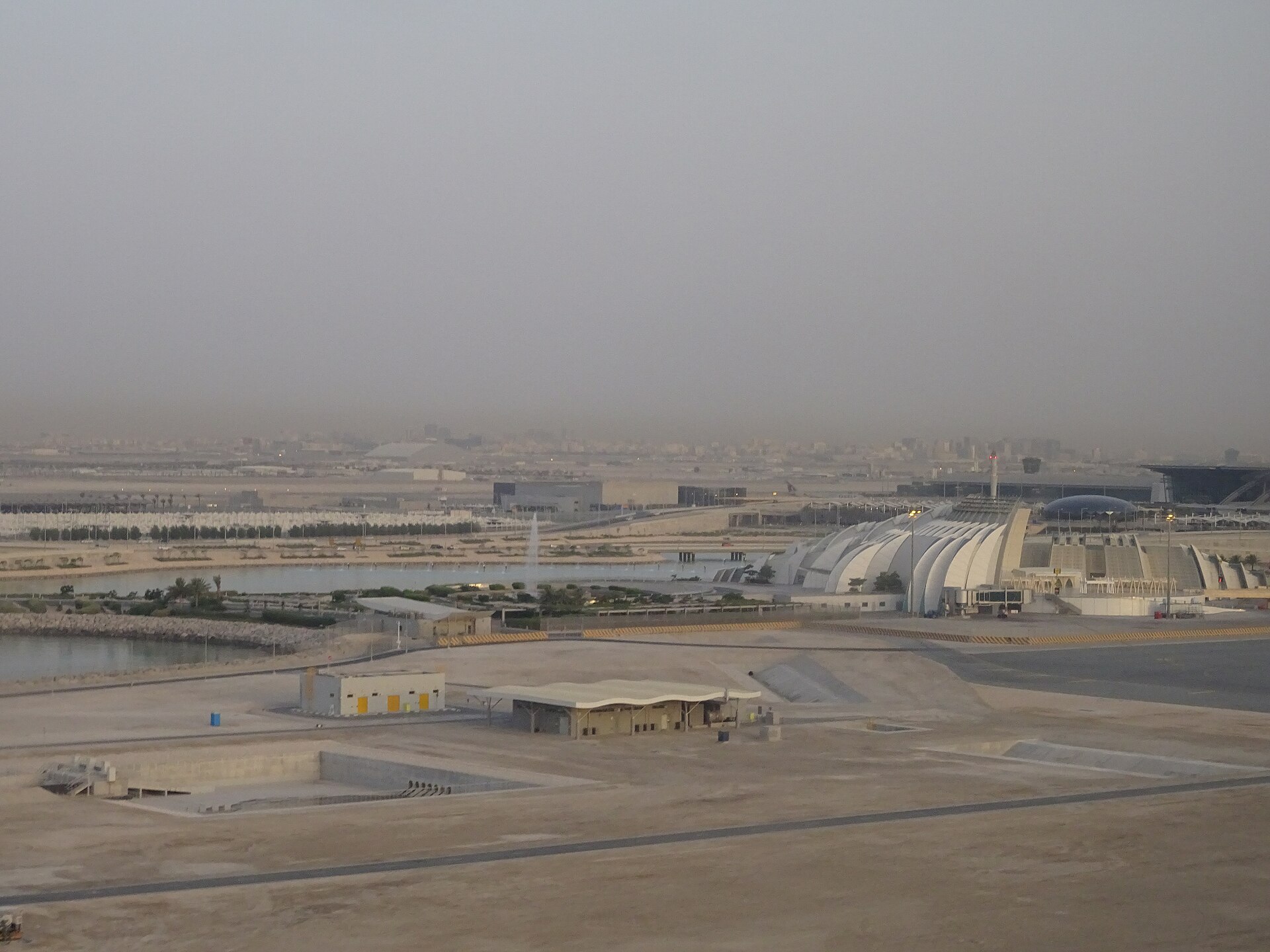 Aerial view of Hamad International Airport terminal, Doha, Qatar, May 2014, showing the distinctive folded-roof passenger terminal building