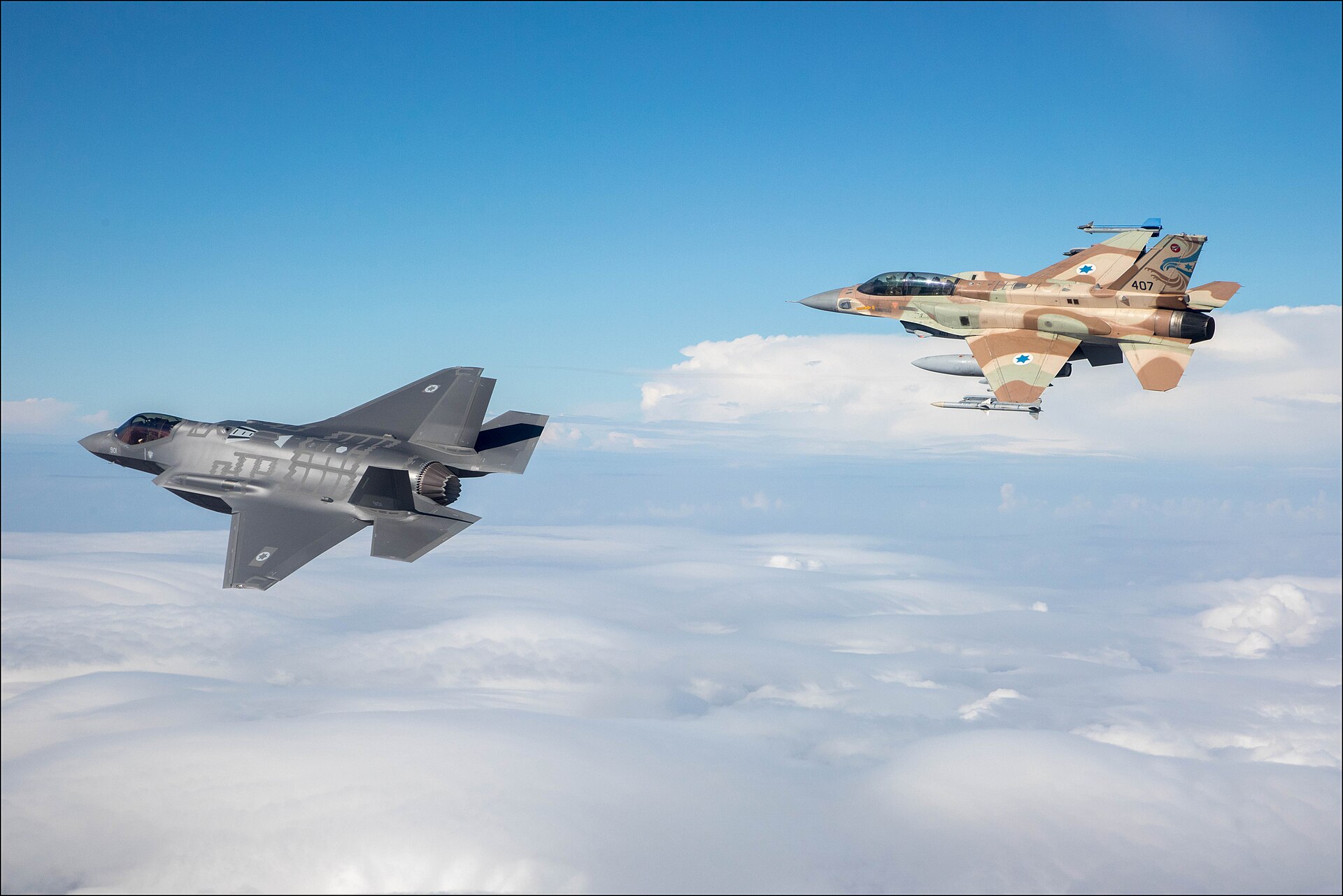 Israeli Air Force F-35I Adir stealth fighter and F-16I Sufa in formation over Israel during the Adir first flight, 2016