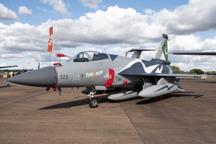 Pakistan Air Force JF-17 Thunder Block III fighter jet on tarmac with Pakistan flag on tail