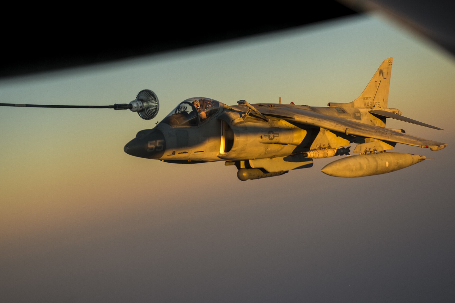 US Marine Corps AV-8B Harrier receives aerial refueling from a KC-135 Stratotanker over Southwest Asia during Operation Inherent Resolve, 2015