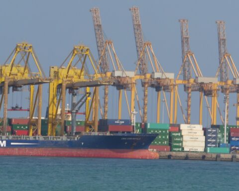 Khor Fakkan container terminal on the UAE eastern seaboard facing the Gulf of Oman, with CMA CGM vessel and loading cranes