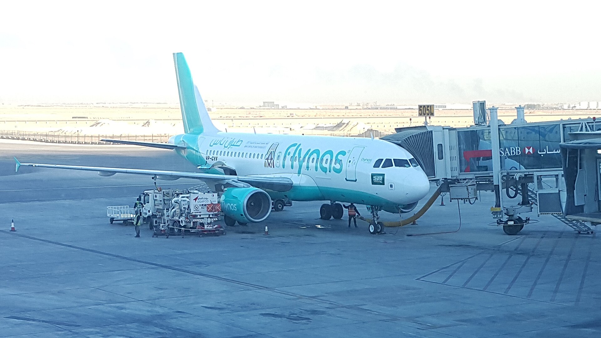 An Airbus A320 aircraft of Flynas at a gate at King Khalid International Airport in Riyadh — the same terminal complex struck by Houthi ballistic missiles on October 8 and October 10, 2026
