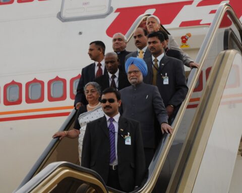Indian Prime Minister Manmohan Singh descends the Air India aircraft stairs at King Khalid International Airport Royal Terminal, Riyadh, February 2010