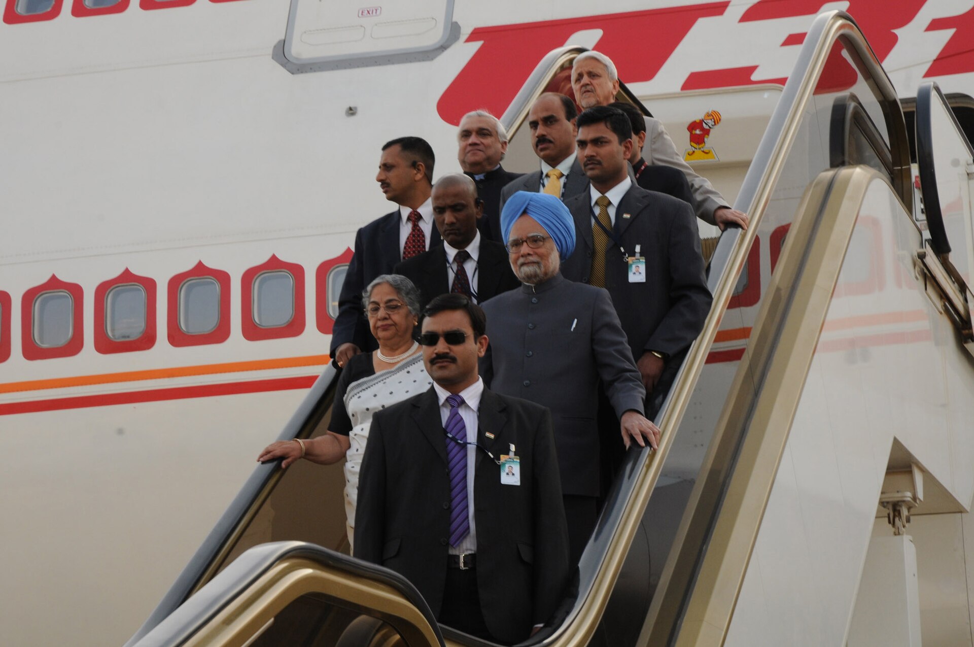 Indian Prime Minister Manmohan Singh descends the Air India aircraft stairs at King Khalid International Airport Royal Terminal, Riyadh, February 2010