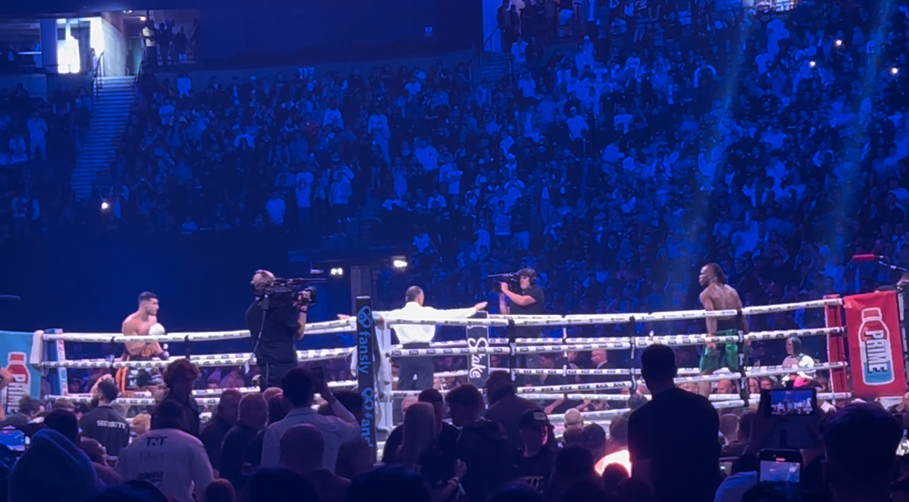 KSI versus Tommy Fury professional boxing match in packed arena during their October 2023 fight