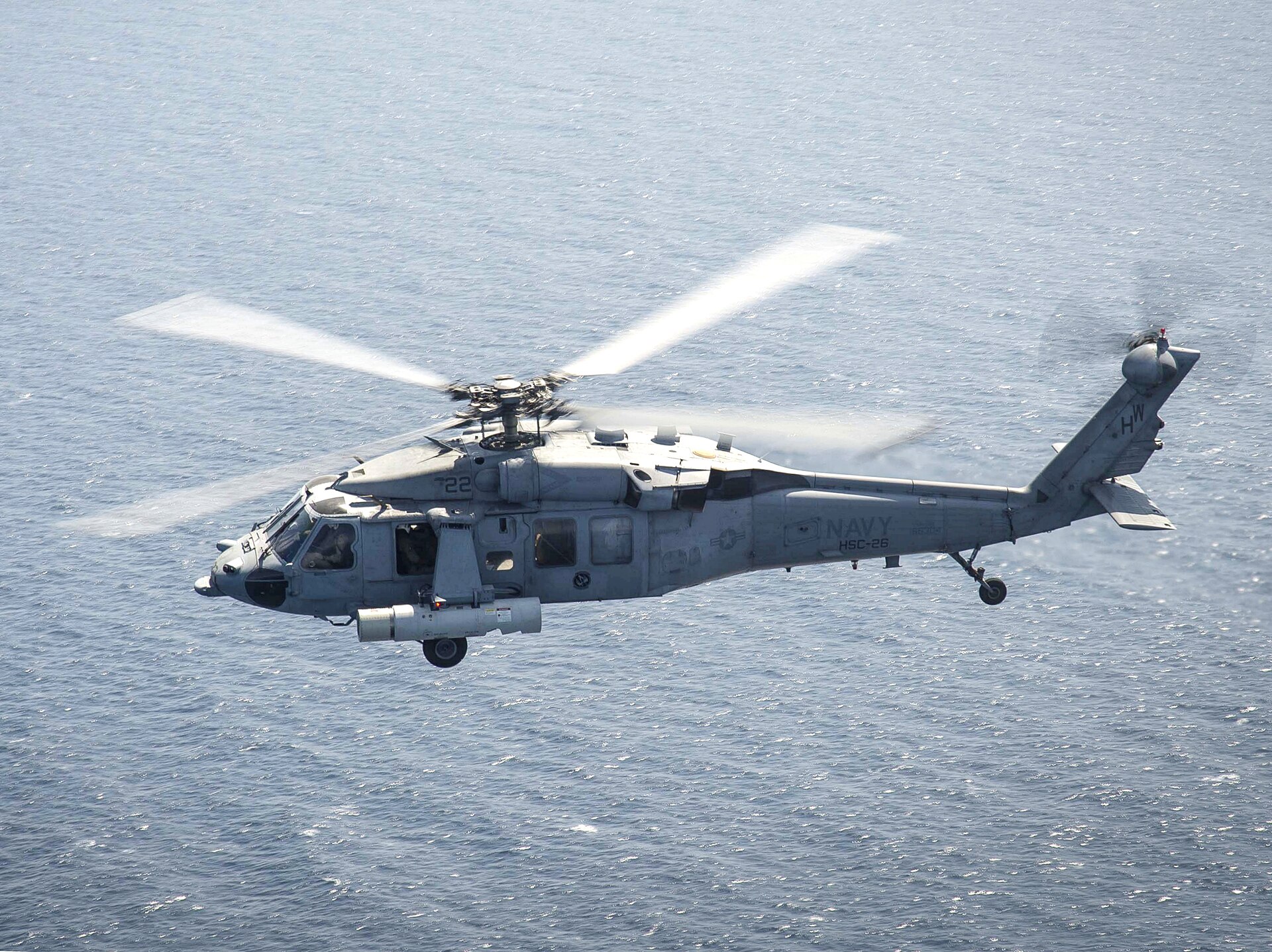 US Navy MH-60S Seahawk helicopter equipped with Airborne Laser Mine Detection System operating over the Persian Gulf near Bahrain