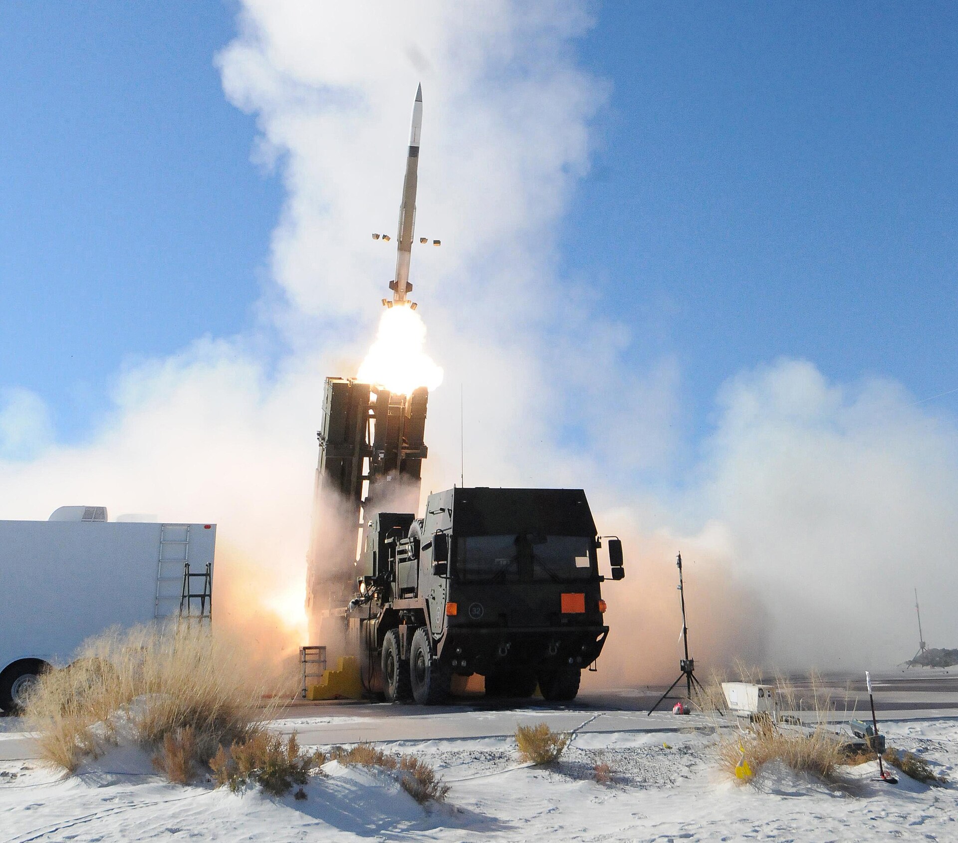 A PAC-3 MSE interceptor launches from a MEADS launcher during a live-fire test at White Sands Missile Range
