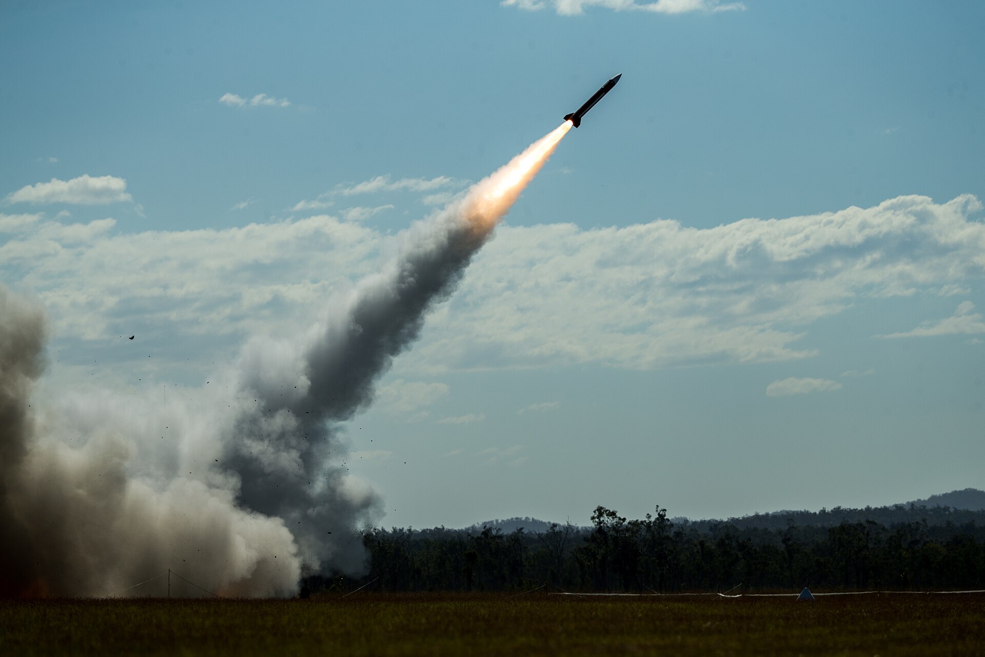 MIM-104 Patriot interceptor missile launches during Exercise Talisman Sabre 2021, showing missile climbing against blue sky with smoke trail
