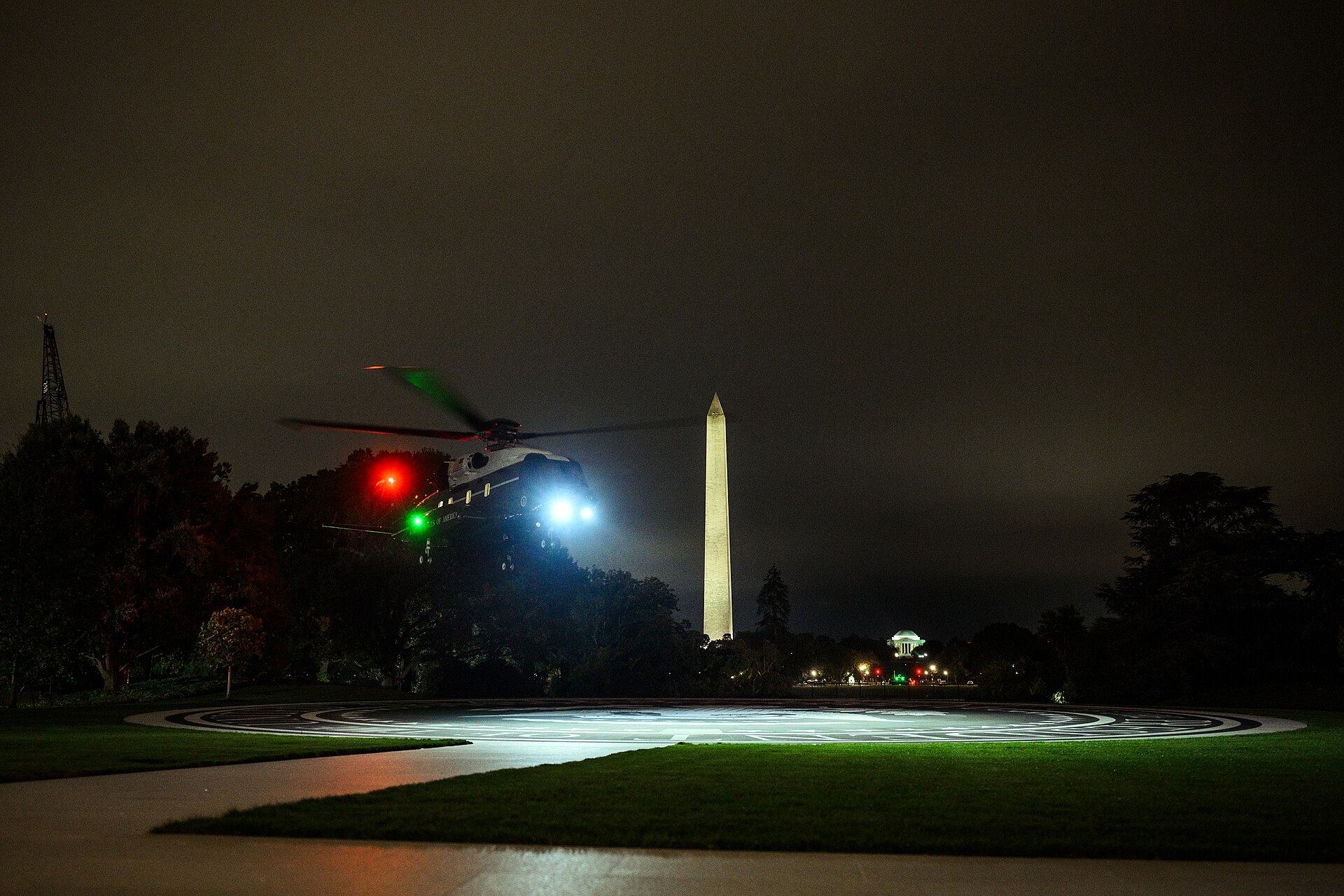 Marine One returns to the South Lawn of the White House, with the Washington Monument illuminated in the background, Saturday night, October 3, 2026. White House photo by Patrick Witty / Public domain