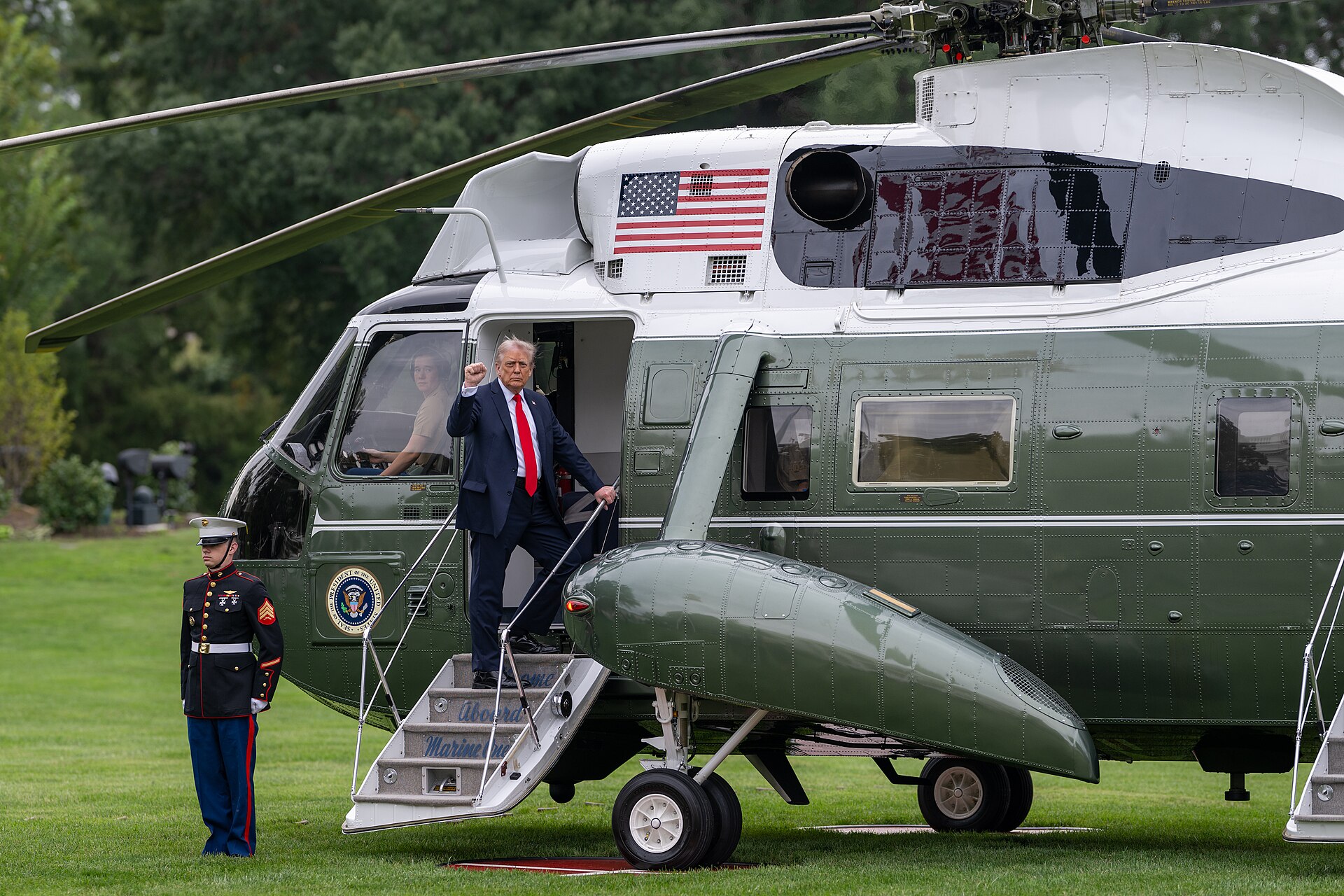 President Donald Trump gestures as he boards Marine One on the South Lawn of the White House