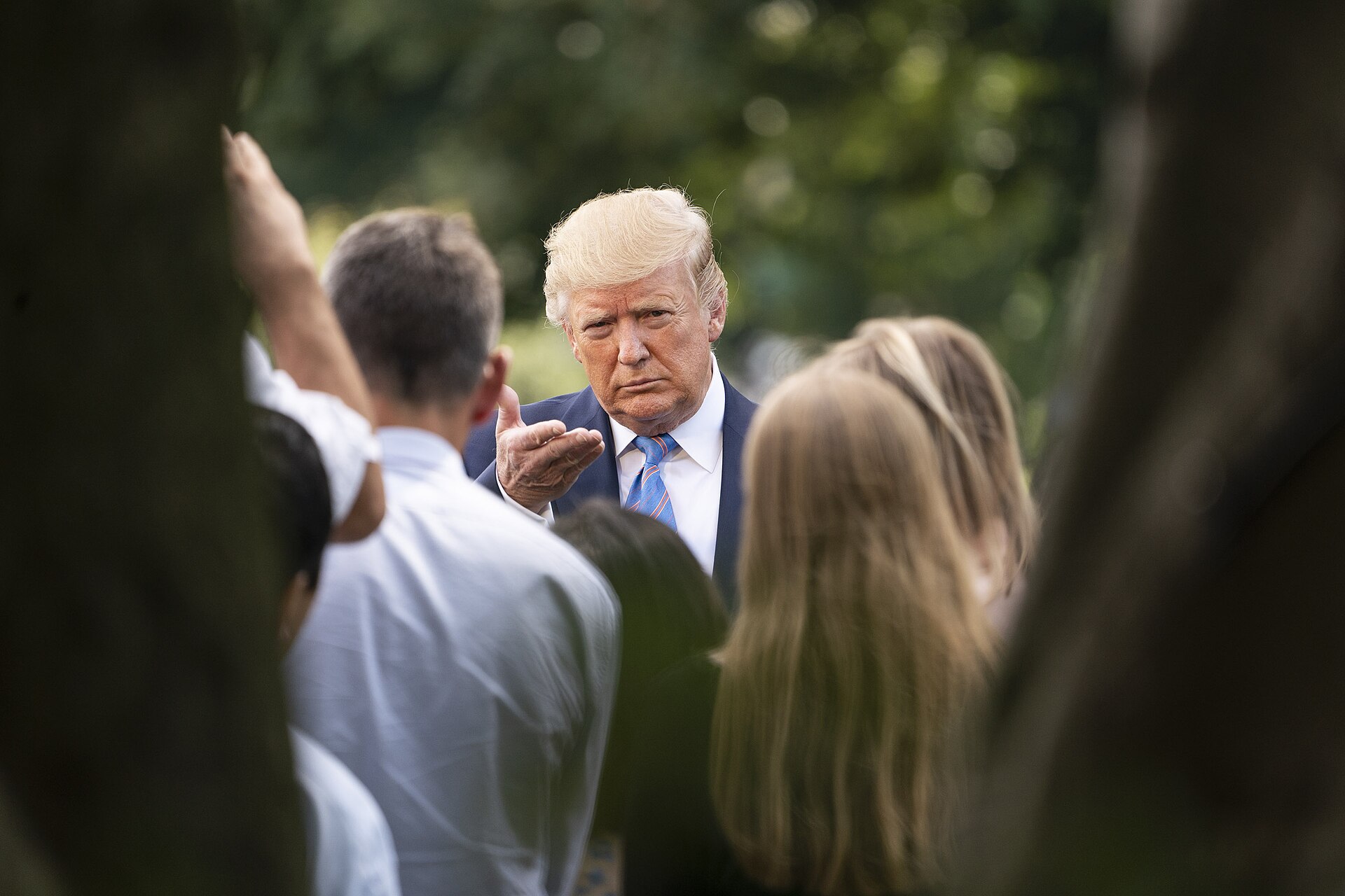 President Donald Trump speaks with reporters on the White House South Lawn driveway before boarding Marine One, the setting for his contradictory October 10, 2026 remarks about US involvement in Saudi strikes against the Houthis