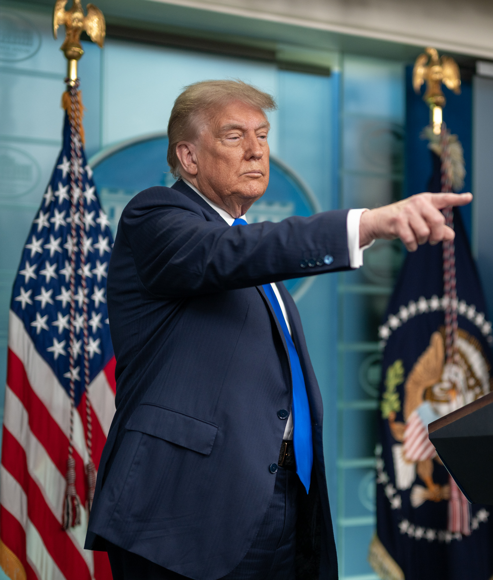 President Donald Trump points to reporters at a White House press briefing, James S. Brady Press Briefing Room, 2025