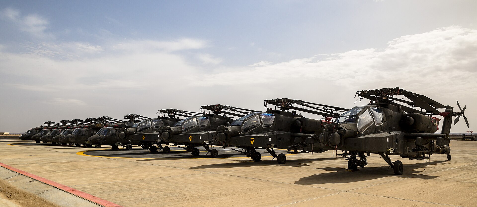 US Army AH-64 Apache helicopters lined up at Tabuk, Saudi Arabia during Exercise Iron Hawk 14 coalition exercise, April 2014