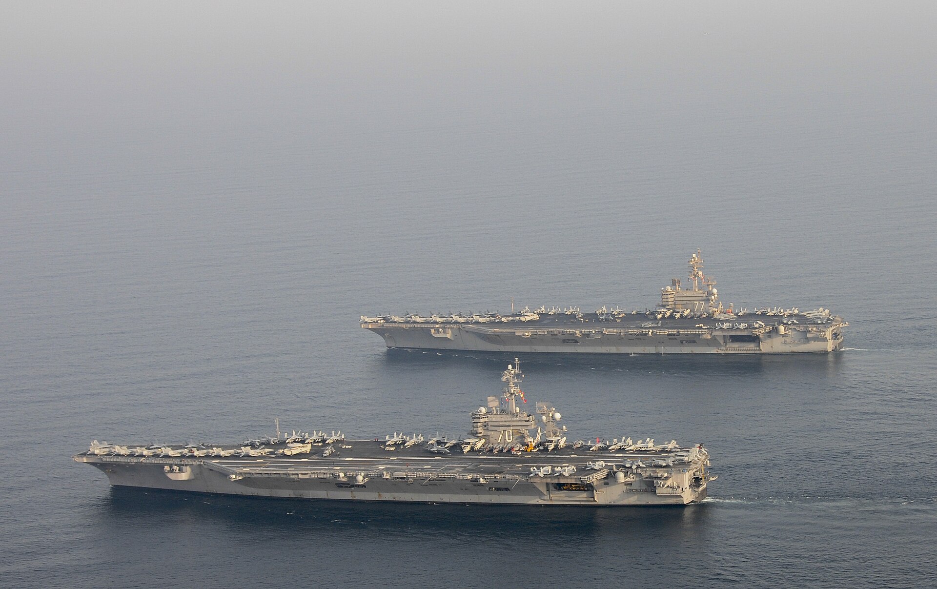 USS Carl Vinson CVN-70 and USS George H.W. Bush CVN-77 aircraft carriers operating together in the Arabian Sea