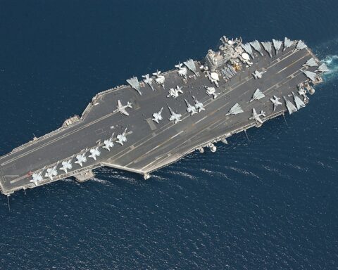 USS George Washington aircraft carrier CVN 73 with flight deck full of aircraft transiting the Arabian Gulf