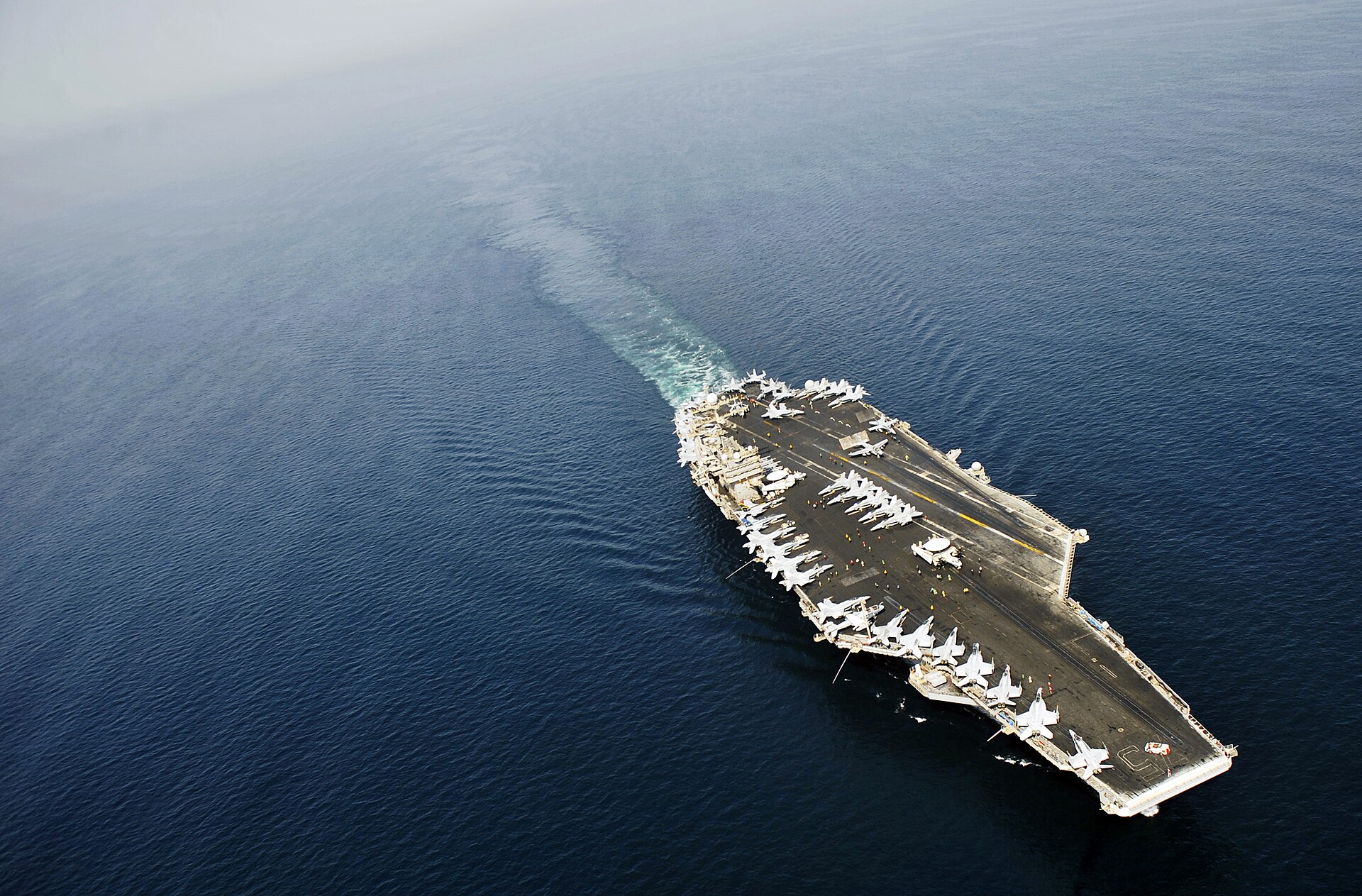 USS Harry S. Truman (CVN 75) aircraft carrier transiting the Arabian Sea with aircraft on flight deck