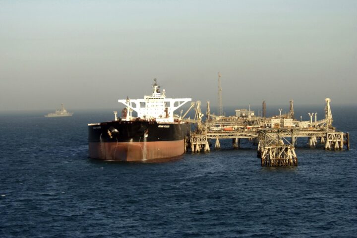 USS Preble guided-missile destroyer patrols the Al Basrah Oil Terminal as a supertanker takes on crude oil in the Persian Gulf