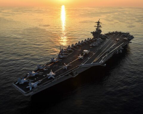 USS Theodore Roosevelt aircraft carrier transits the Arabian Gulf at sunset, December 2017