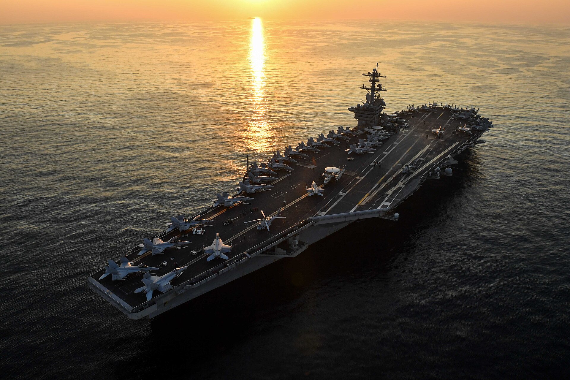 USS Theodore Roosevelt aircraft carrier transits the Arabian Gulf at sunset, December 2017