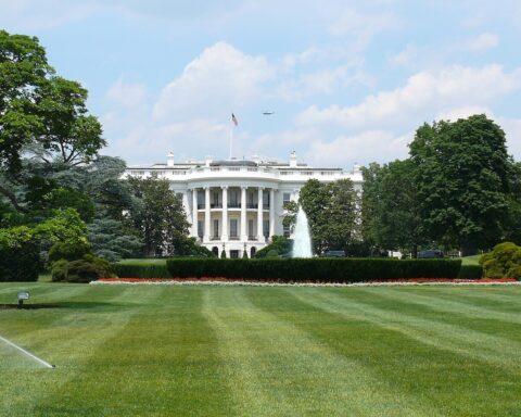 The White House South Portico with fountain and US flag, Washington DC
