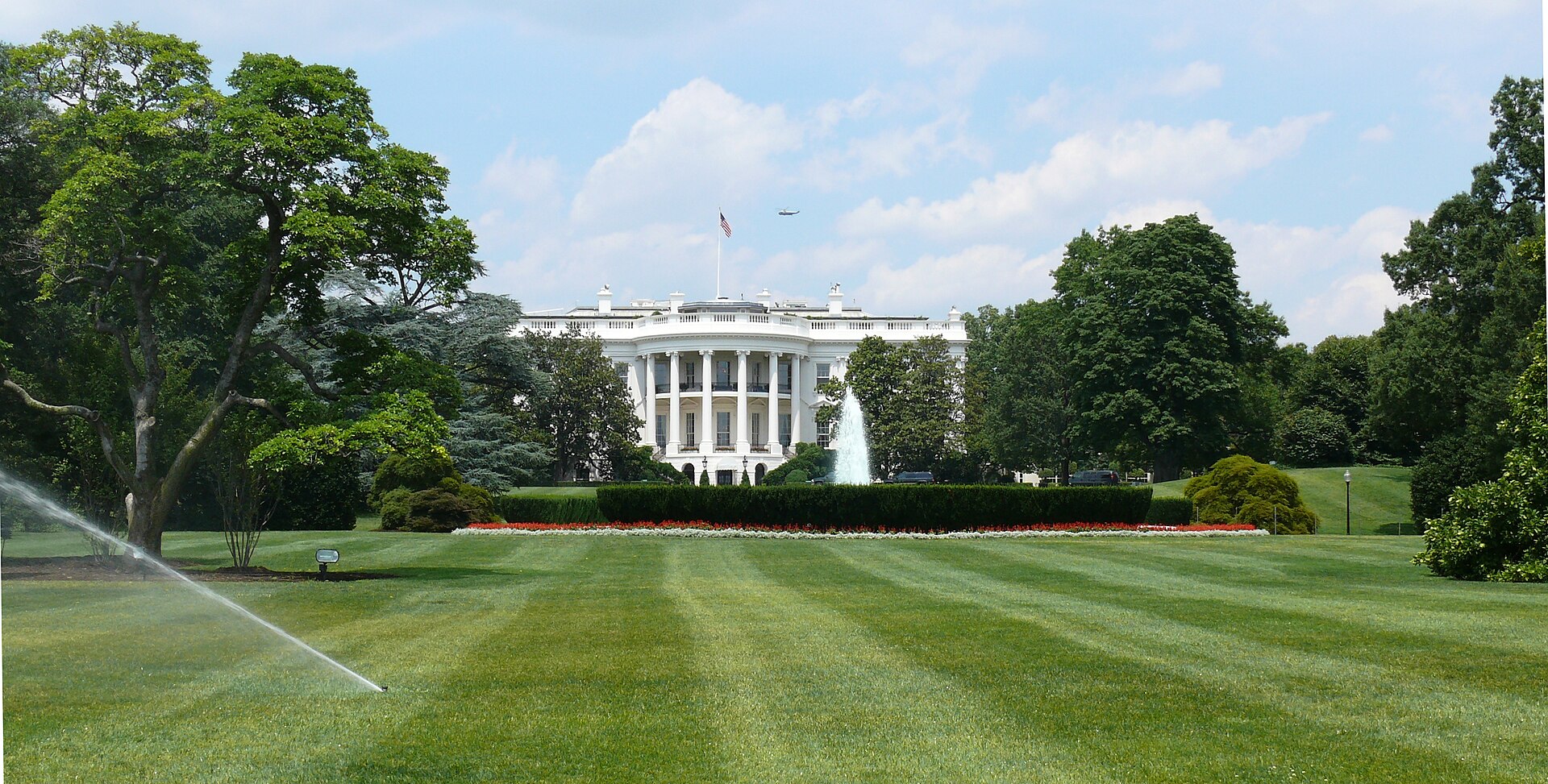 The White House South Portico with fountain and US flag, Washington DC
